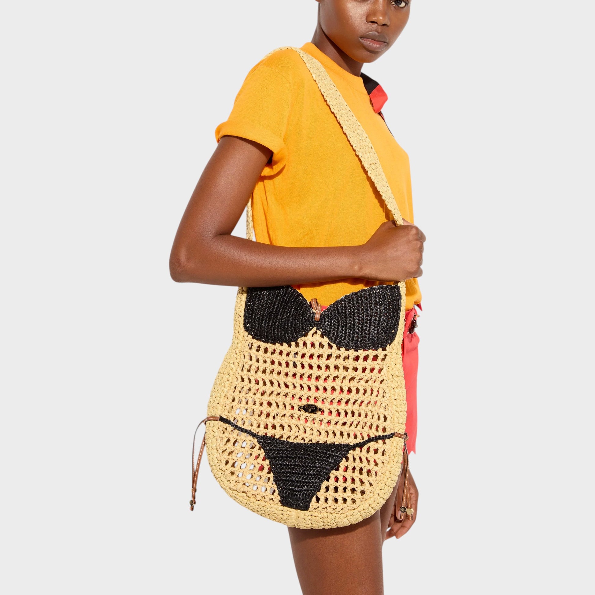 Tasoni Pucci Bag: a raffia shoulder bag designed to look like a bikini in natural and black.