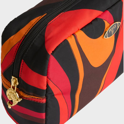 Tasoni Pucci bag with a bold orange, red, and black wavy print. Features a gold zipper with a charm and a gold logo plaque.