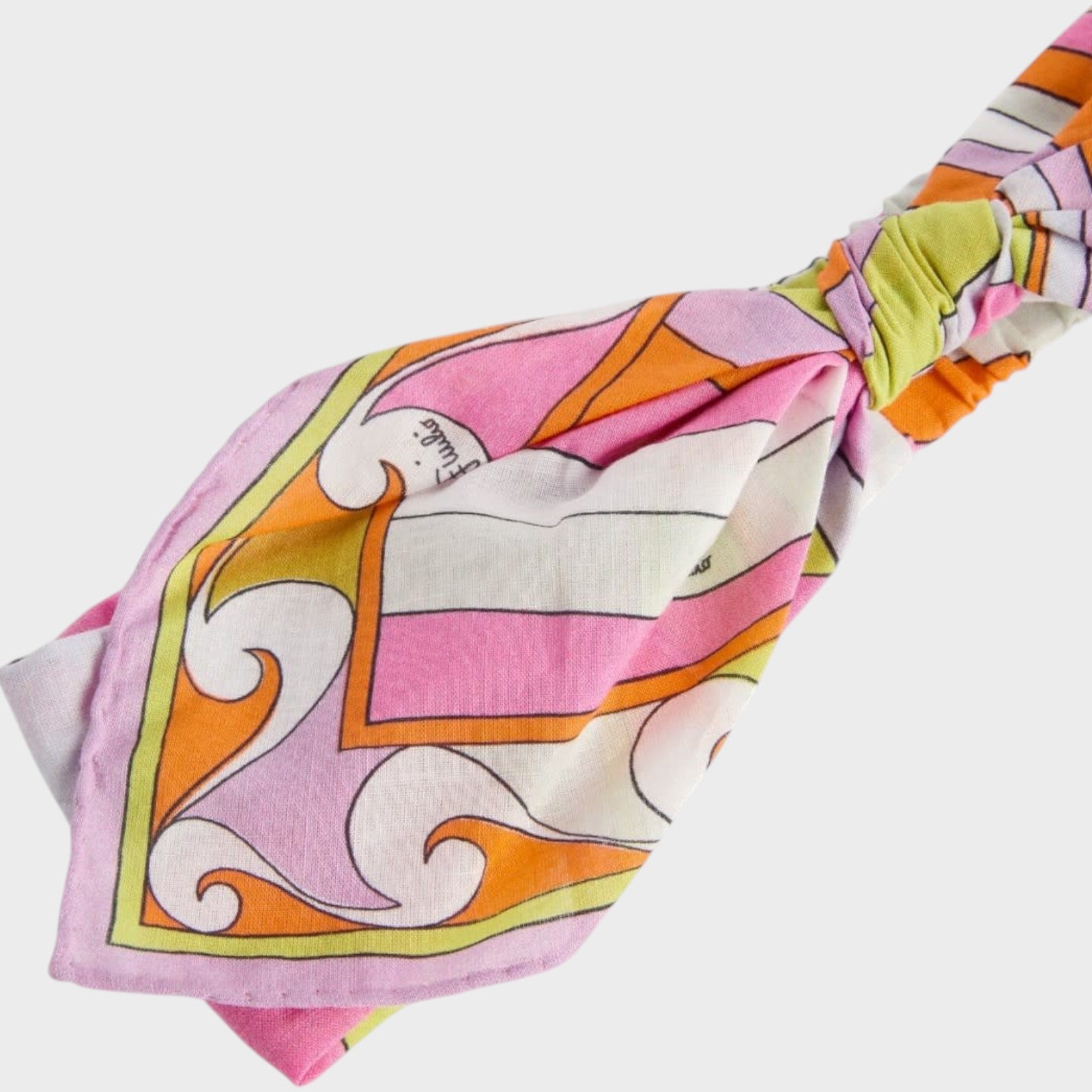 Tasoni Pucci bow headband bandana featuring a vibrant pink, orange, and lime green geometric print on soft fabric.