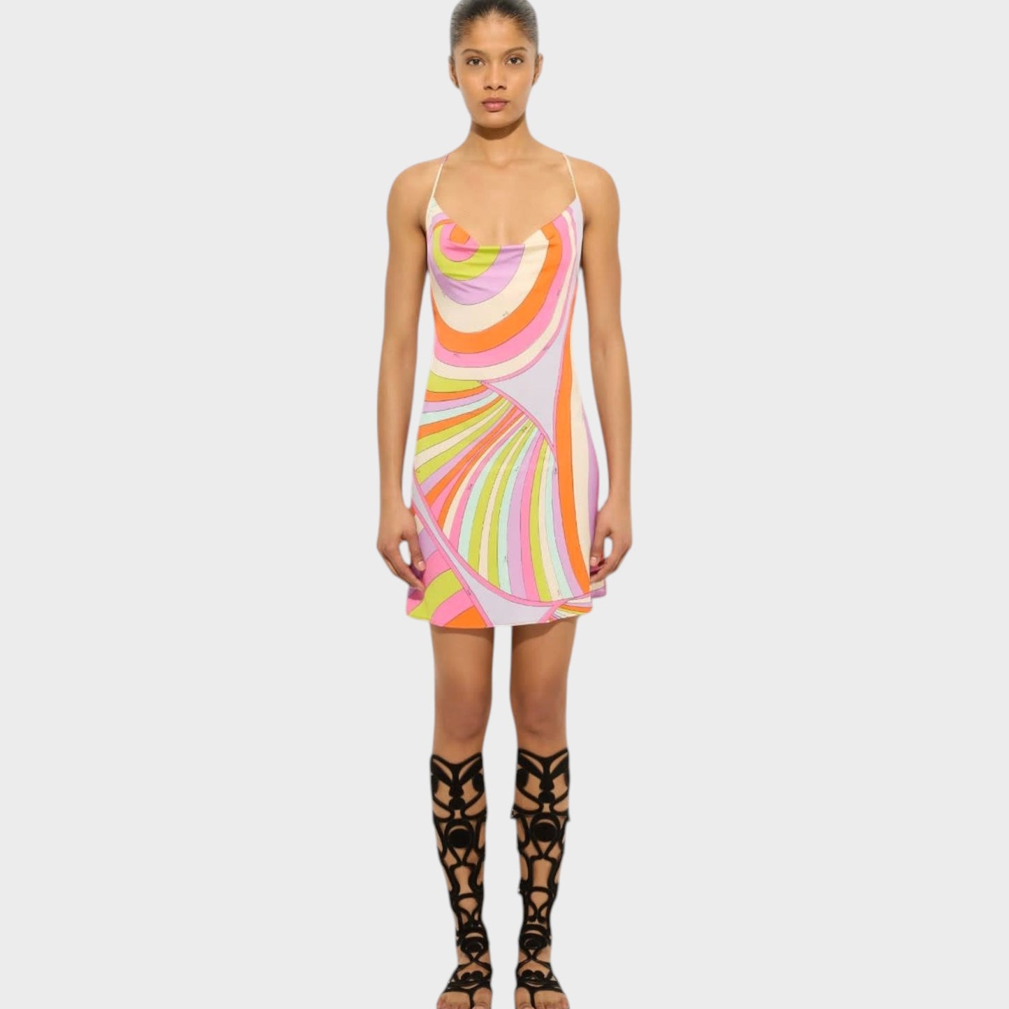 Tasoni Pucci multicolor Iride print mini dress with a deep cowl neck and thin straps worn by a model.
