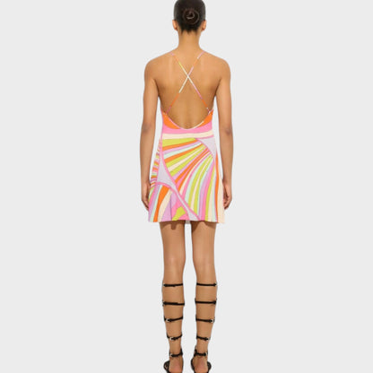 Tasoni Pucci multicolor mini dress with Iride print, deep back, and crisscross straps worn by a model.