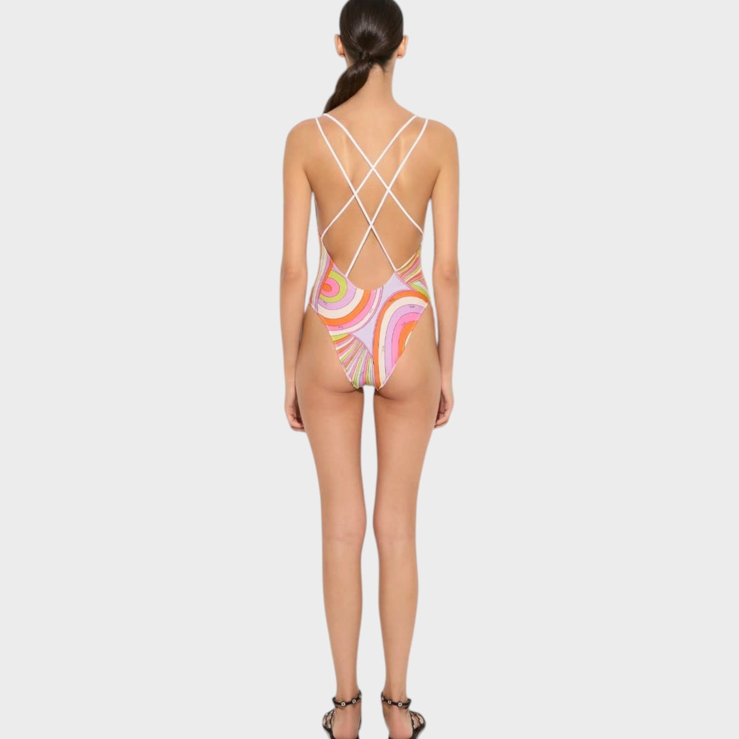 Tasoni Pucci multicolor Iride print one-piece swimsuit with a crisscross back design worn by a model.