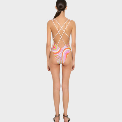 Tasoni Pucci multicolor Iride print one-piece swimsuit with a crisscross back design worn by a model.