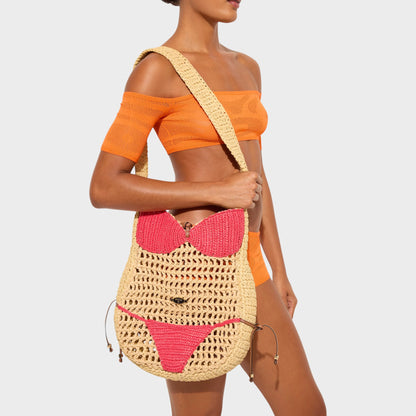 Tasoni Pucci Raffia Shoulder Bag in natural and pink, designed to resemble a bikini. Features a crochet knit.