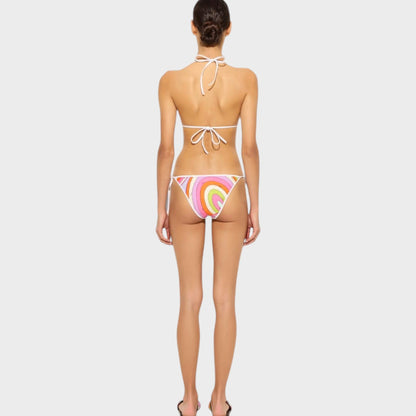 Model wearing a Tasoni Pucci triangle bikini top with a colorful swirl print and white tie-back straps.