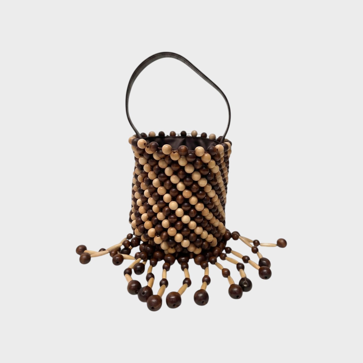 Tasoni Rabanne bucket bag featuring a brown and beige wooden bead lattice design with dangling beaded fringe