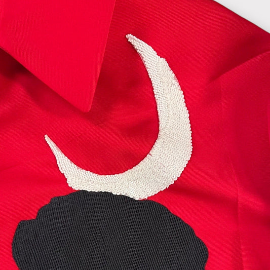 Tasoni red jacket with classic collar, featuring a white sequined crescent moon and black embroidered motive.