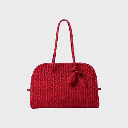 Tasoni red raffia tote bag with braided handles and a decorative knot detail.