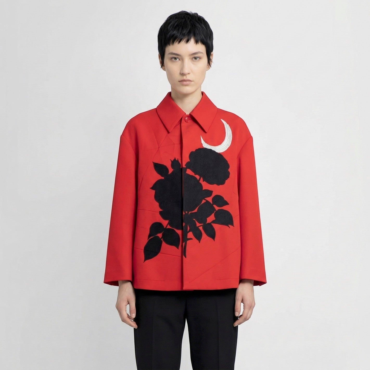 Tasoni red jacket with classic collar, button-up front, and black rose and moon motif.