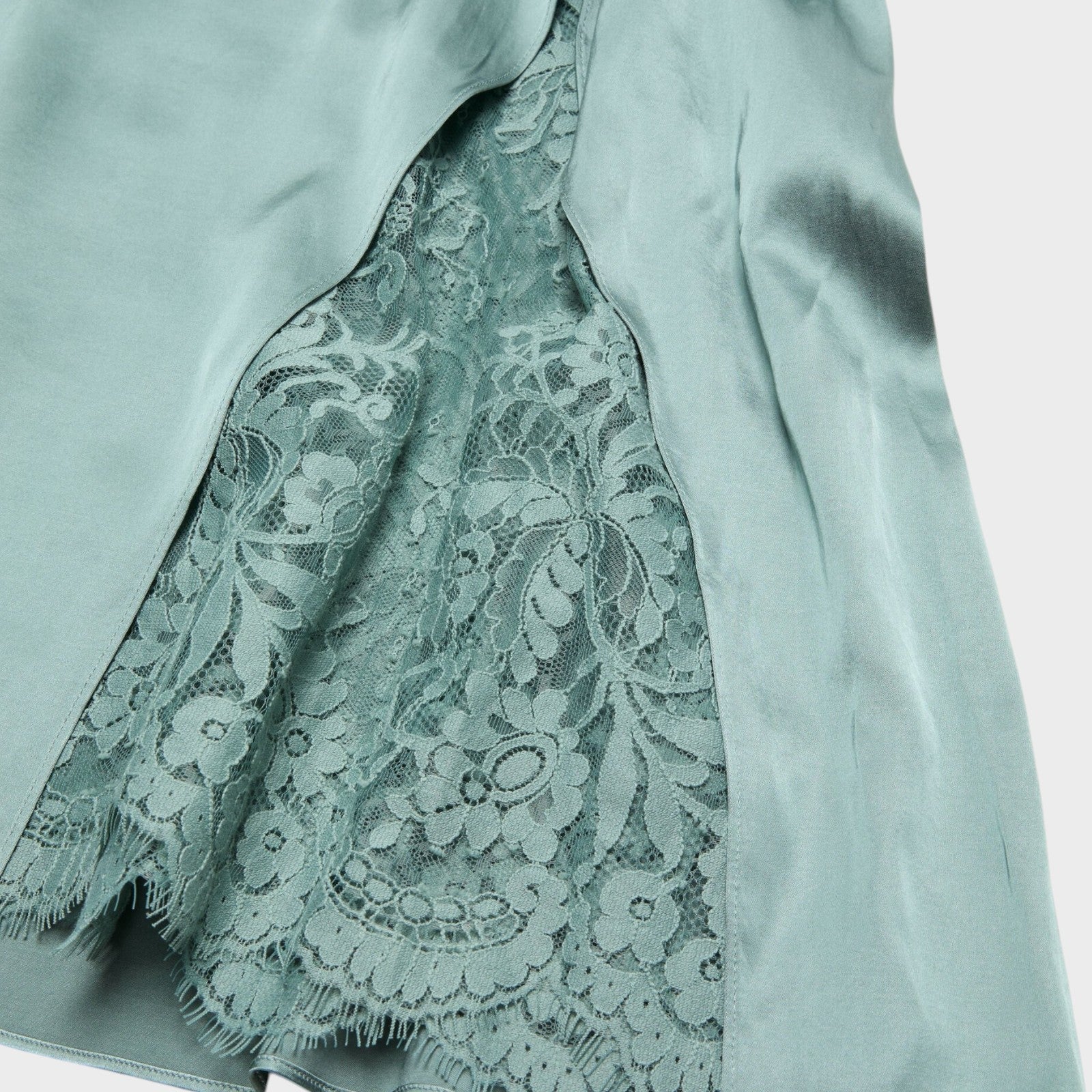 Tasoni sage green sleeveless slip midi dress with lace panel detail and frayed hem.