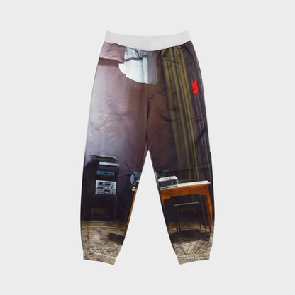 Tasoni silk elastic waist sweatpants with a realistic print of a room interior, featuring audio equipment and curtains.