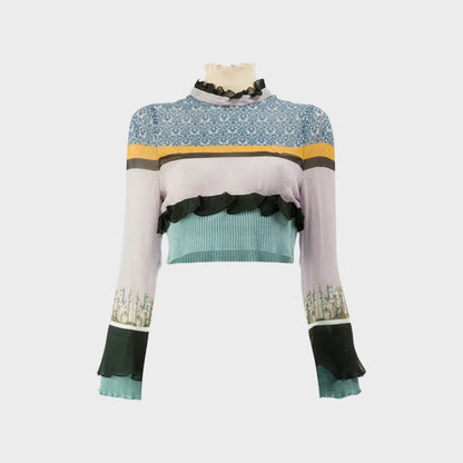 Tasoni Undercover Silk Top with a high neck, ruffles, and a pastel striped pattern with city skyline print on sleeves.