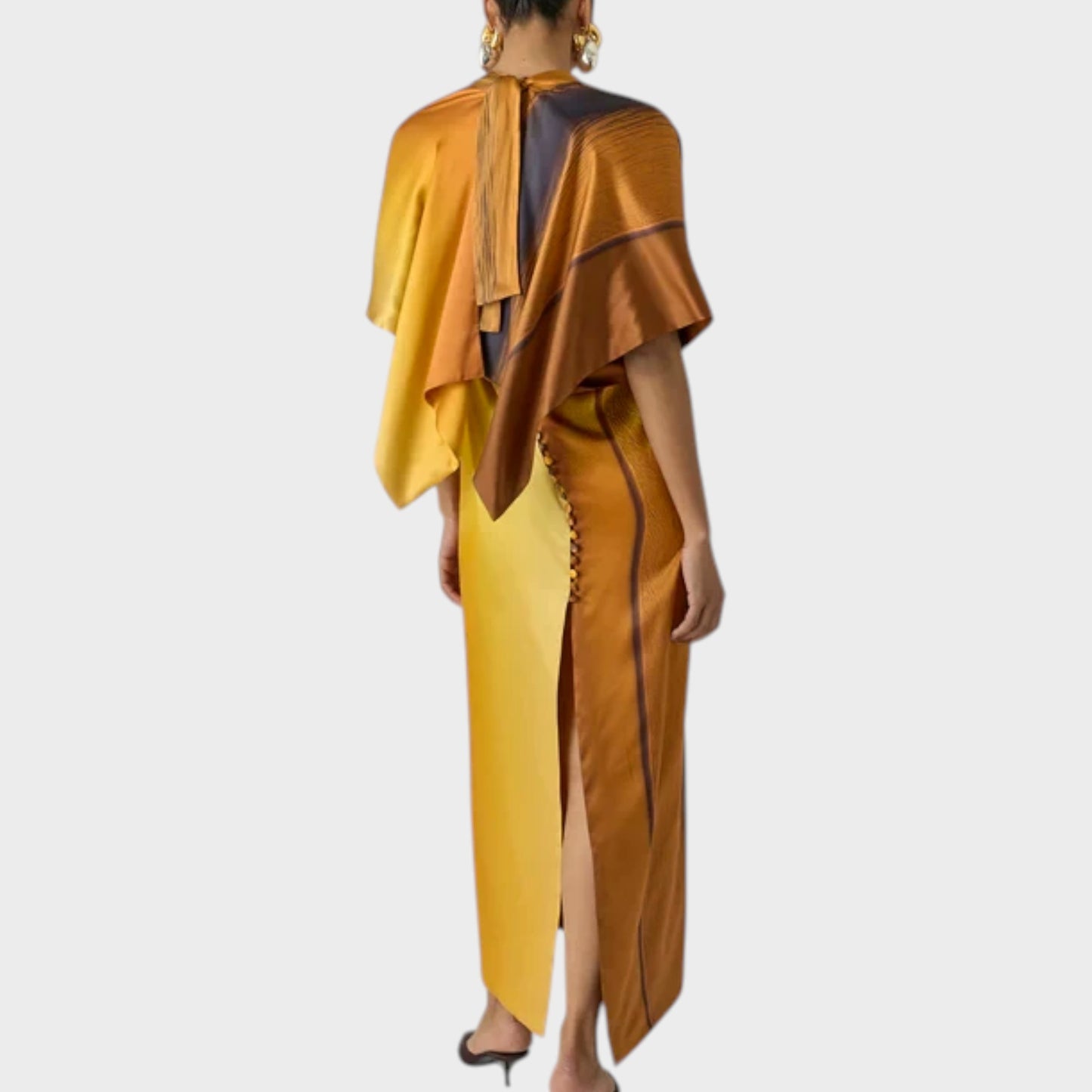 Tasoni Marie Adam-Leenaerdt Silk Satin Print Sunset Landscape Dress in sunset light orange with a high slit and button detail.