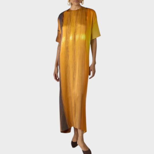 Tasoni Marie Adam-Leenaerdt silk satin dress with a sunset landscape print in orange and brown hues.