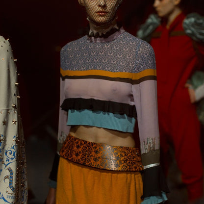 Tasoni Undercover Silk Top: a long-sleeved, cropped knit top with a patterned yoke, horizontal stripes, ruffled trim, and contrasting cuffs.