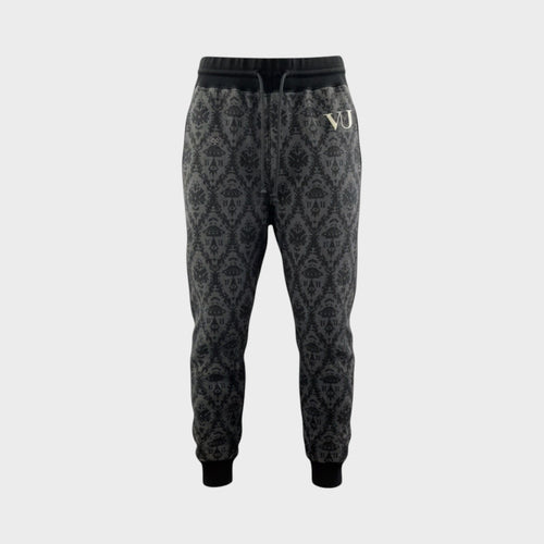 Tasoni Undercover x VLTN black and grey cotton drawstring sweatpants with all-over pattern and gold 'VJ' logo.