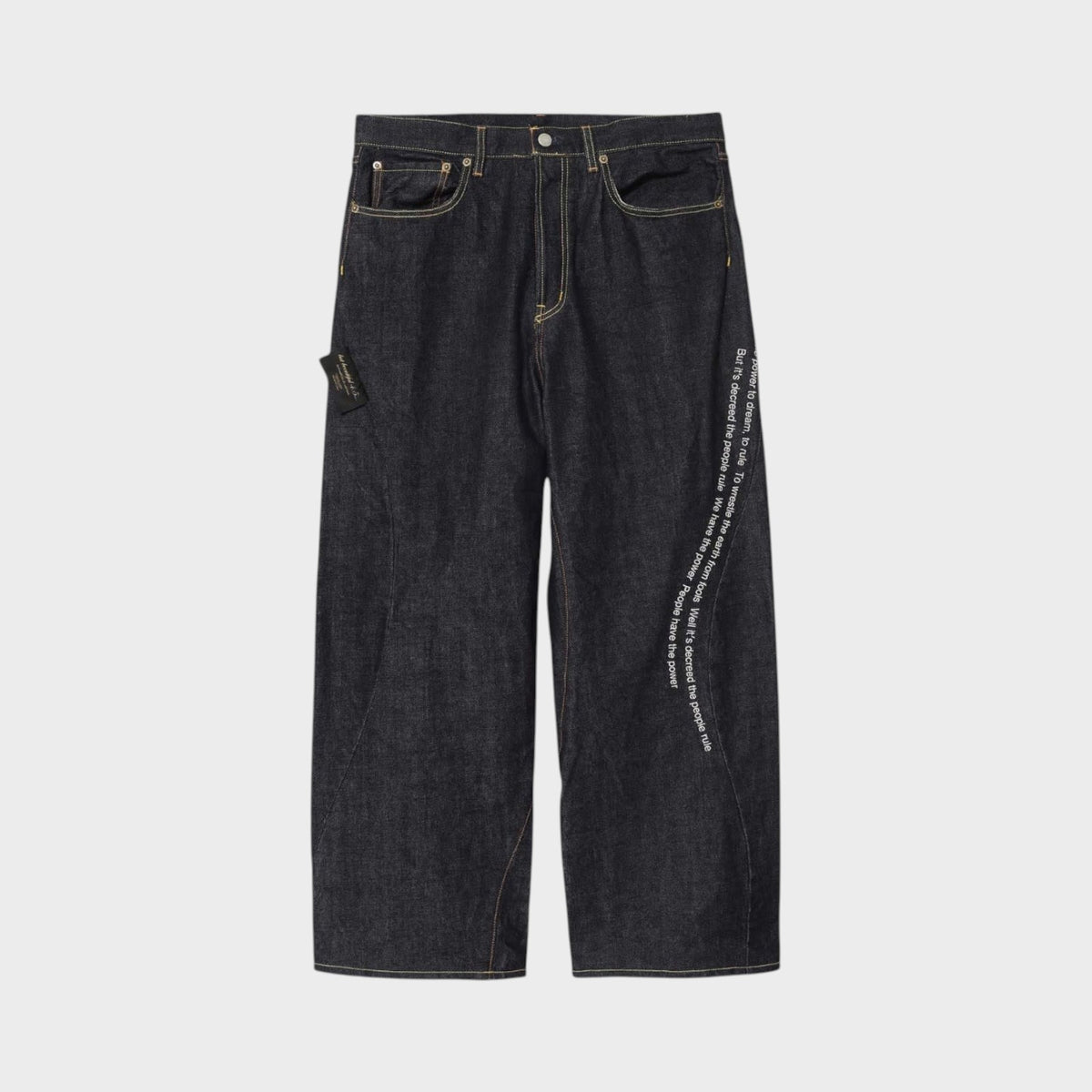 Tasoni x Undercover Patti Smith wide leg indigo denim pants with embroidered poem detail.