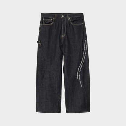 Tasoni x Undercover Patti Smith wide leg indigo denim pants with embroidered poem detail.