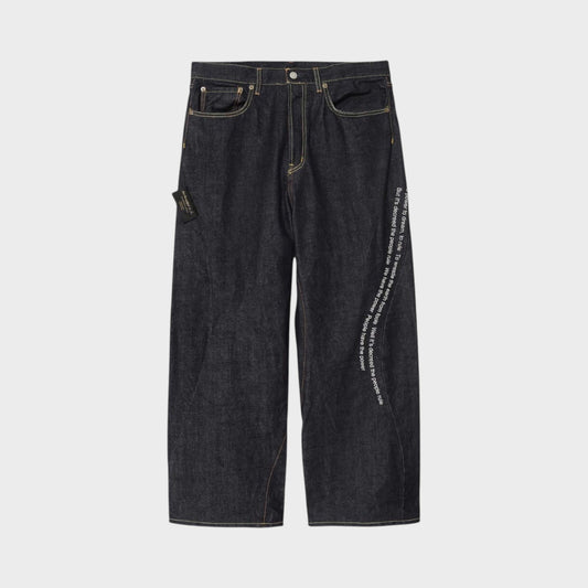 Tasoni x Undercover Patti Smith wide leg indigo denim pants with embroidered poem detail.