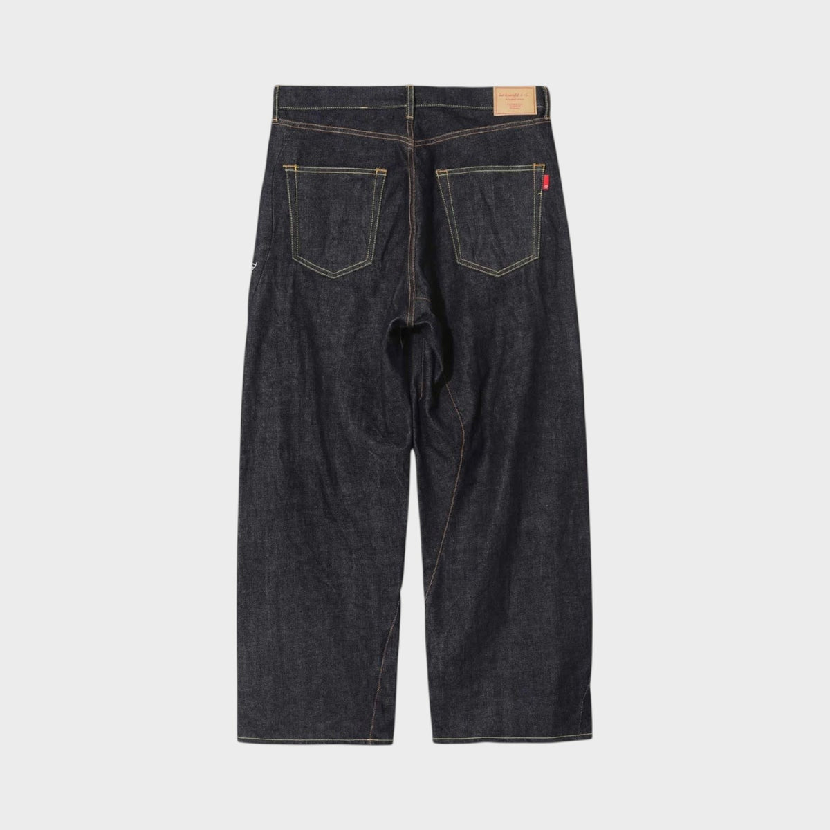 Tasoni x Undercover Patti Smith wide leg indigo denim pants with embroidered poem detail.