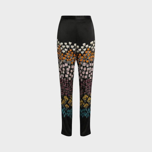 Tasoni Valentino black velvet trousers featuring a vibrant multi-colored floral row print pattern.