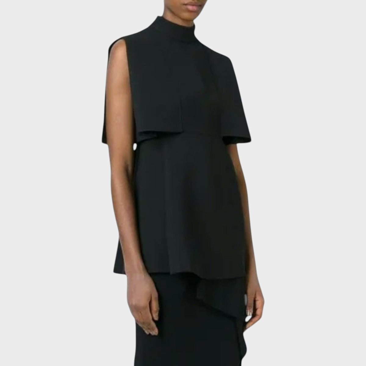 Model wearing a black Tasoni Valentino wool shantung tank top with a high neckline and structured cape-style sleeves.