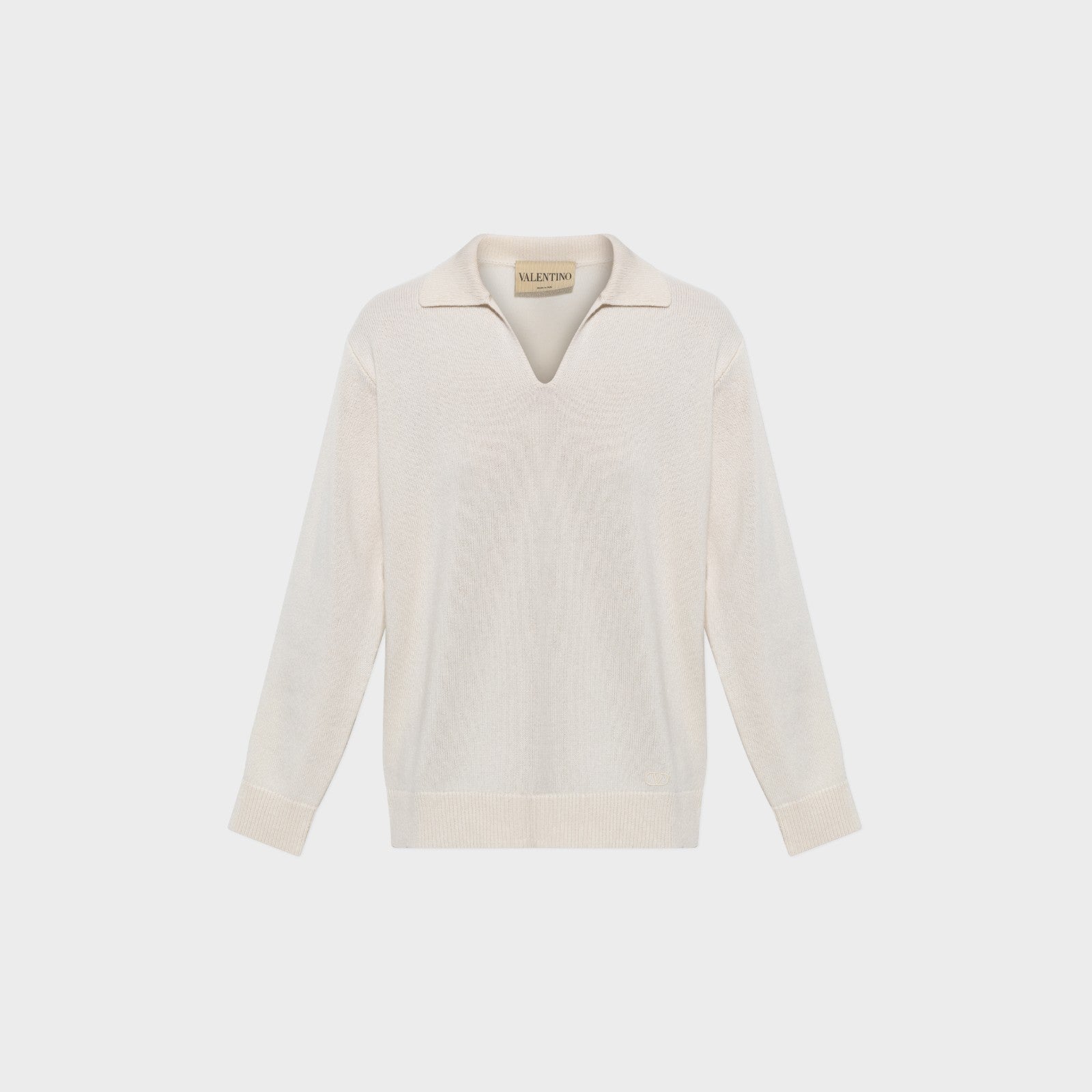 Tasoni Valentino cream cashmere V-neck polo sweater with long sleeves and ribbed cuffs and hem.