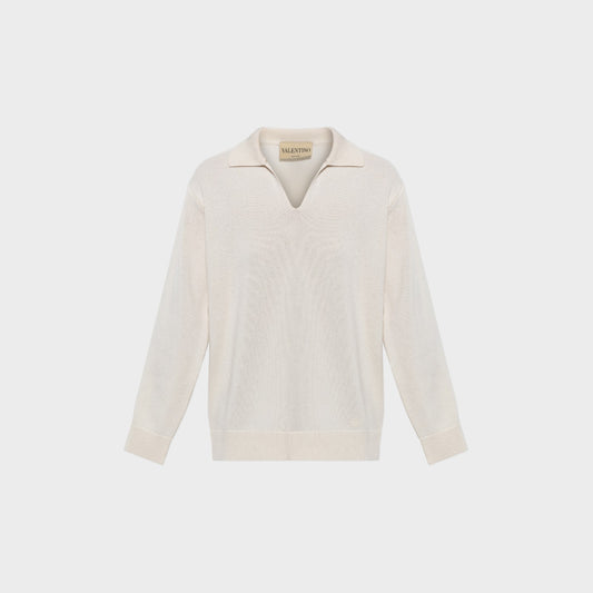 Tasoni Valentino cream cashmere V-neck polo sweater with long sleeves and ribbed cuffs and hem.