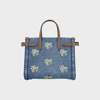 Tasoni Valentino small denim tote bag with multicolor flower bouquet embroidery and brown leather handles.