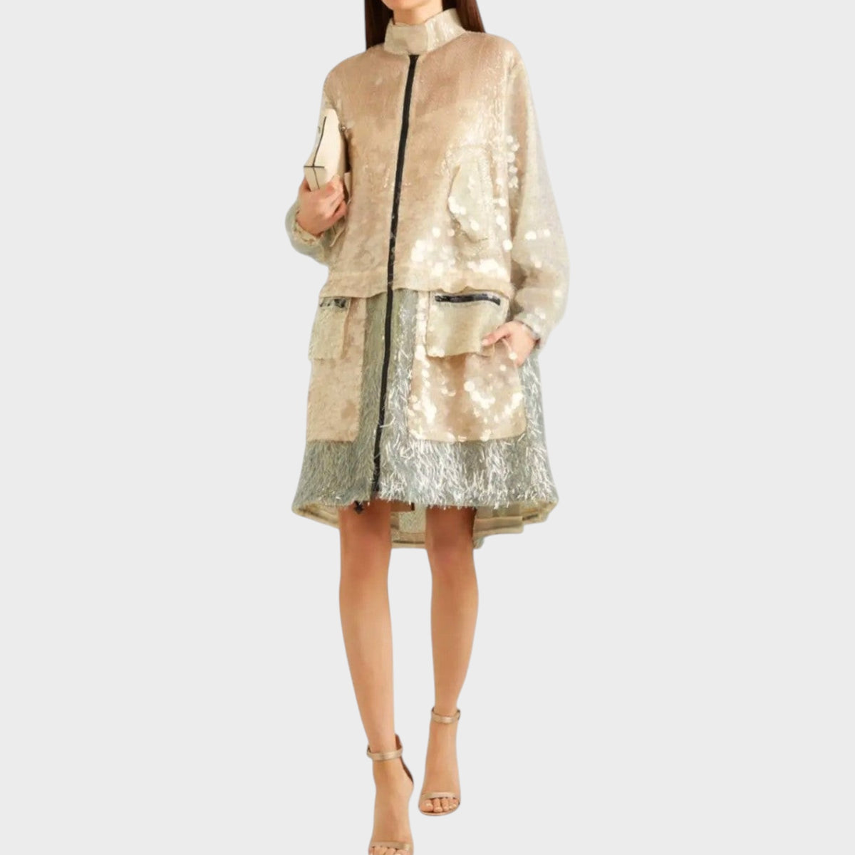 Model wearing a Tasoni Valentino embellished coat in shimmering gold and silver with a high collar and pockets.