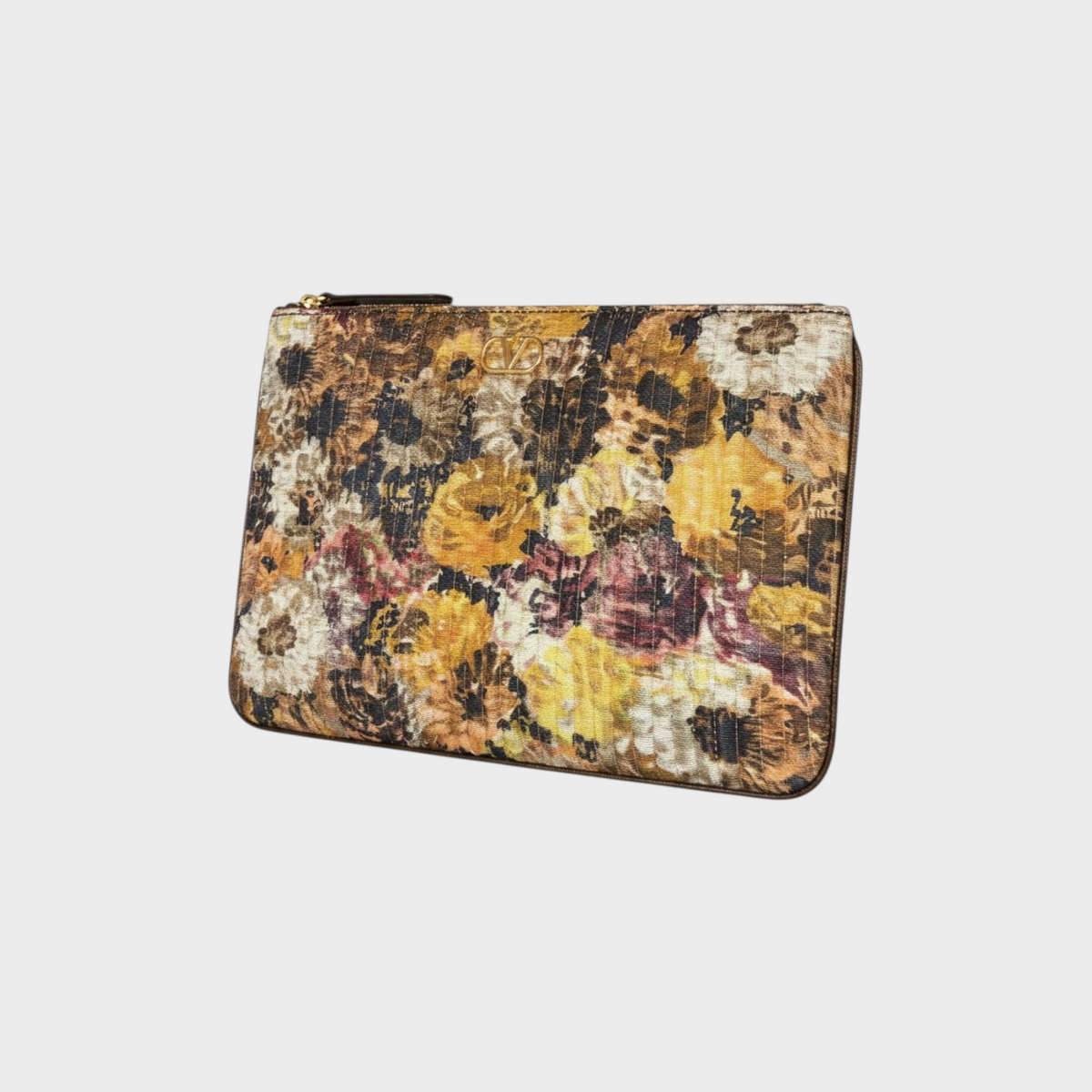 Tasoni Valentino medium flat pouch featuring a vibrant floral print in yellow, brown, and cream with gold logo detail.