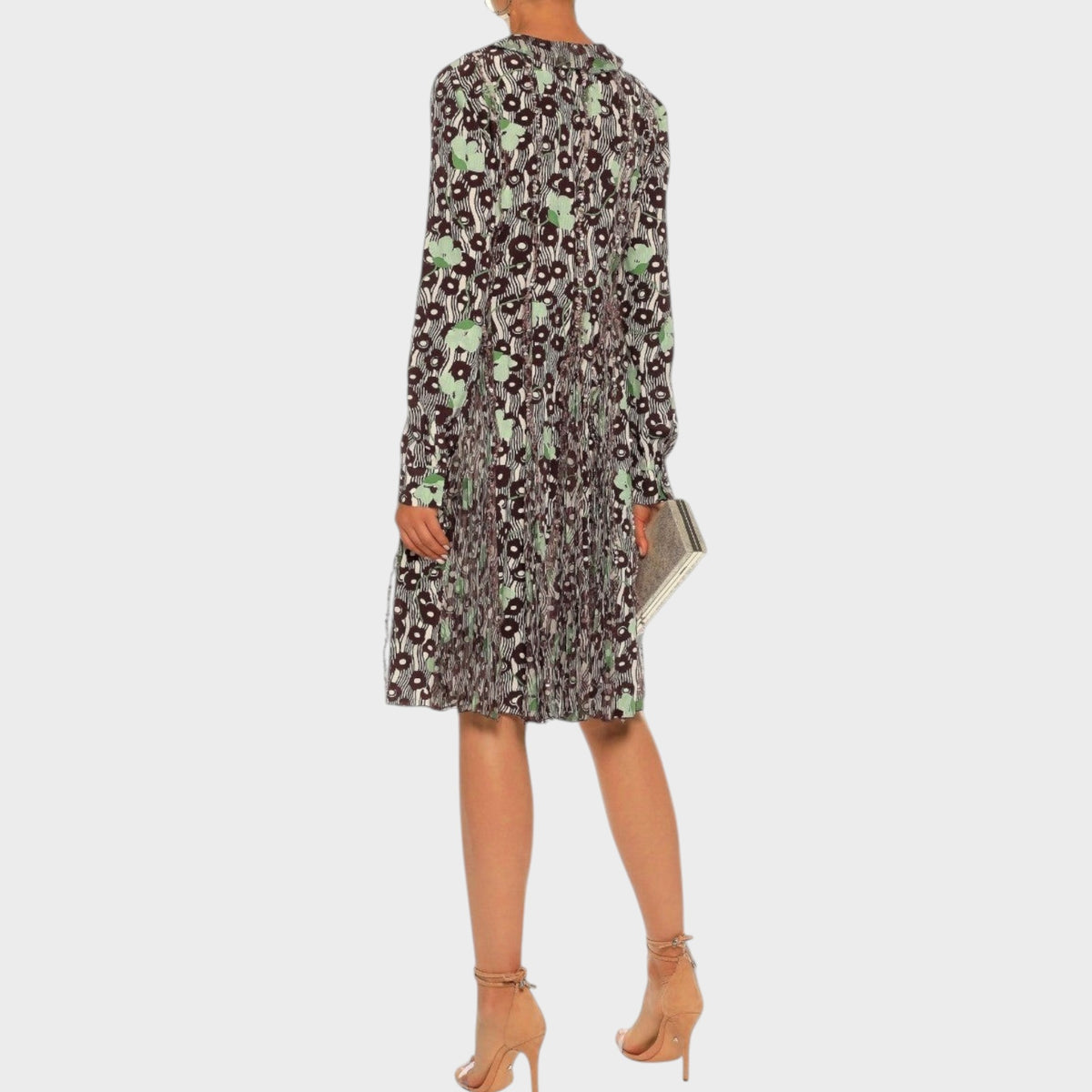 Tasoni Valentino knee-length dress with a dark floral print and pleated skirt worn with nude heeled sandals