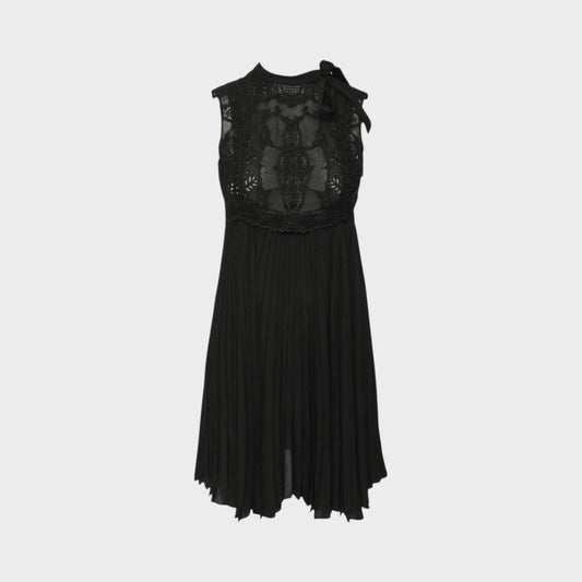 Tasoni Valentino Fusion black sleeveless dress with intricate lace bodice, high neck, and pleated skirt