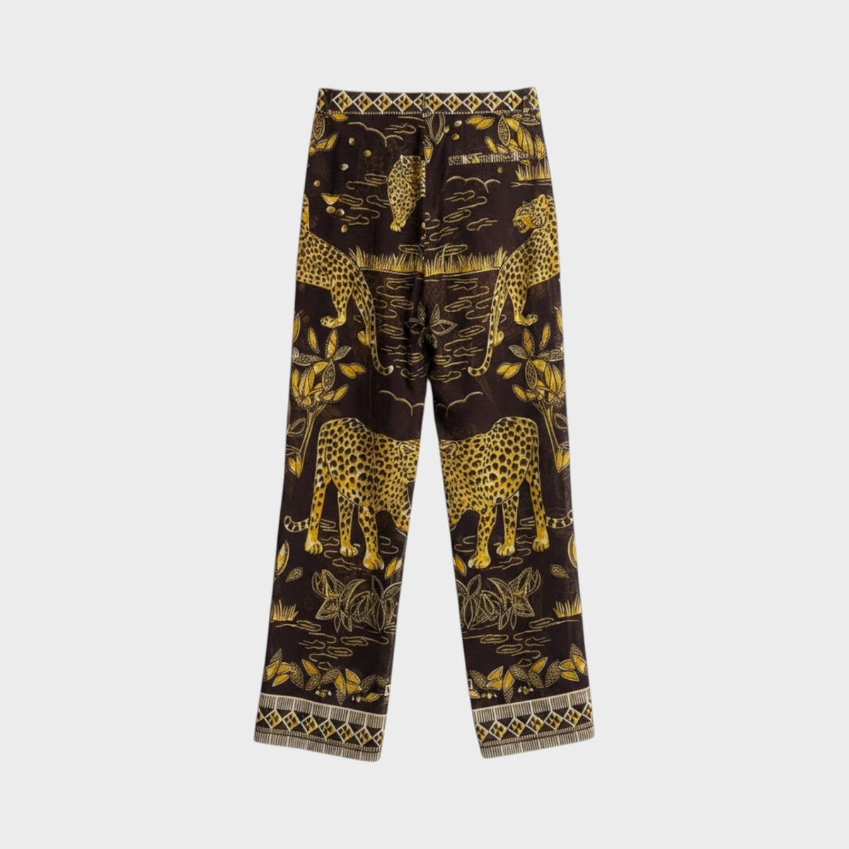 Tasoni Valentino jaguar print long trousers in dark brown with gold botanical details and geometric hem patterns.