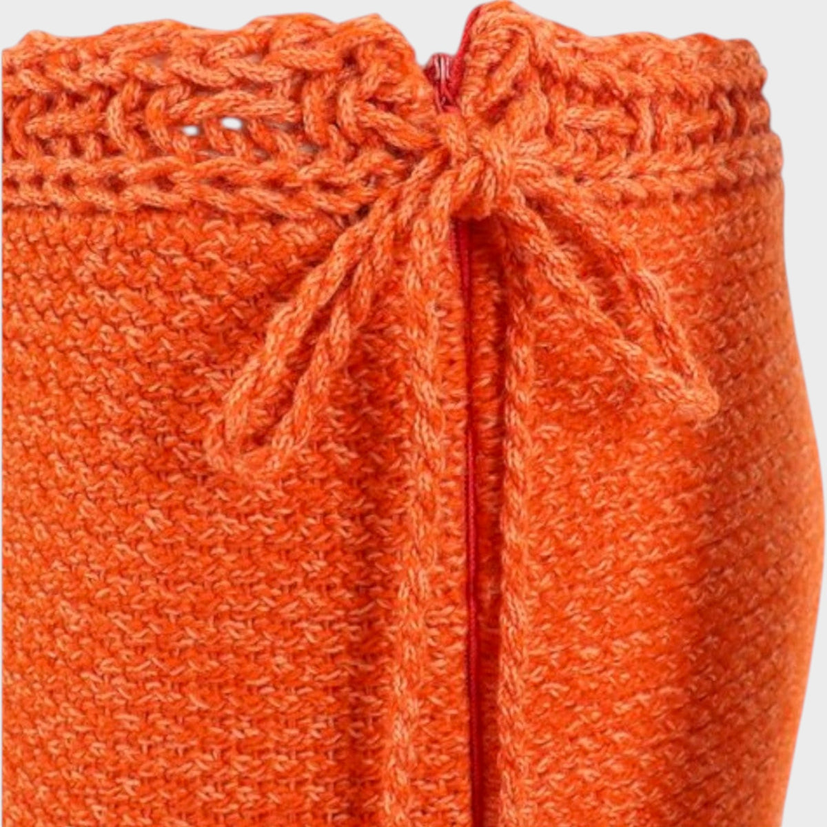 Tasoni Valentino orange wool pleated crochet skirt featuring a detailed knit waistband with a central tie closure.