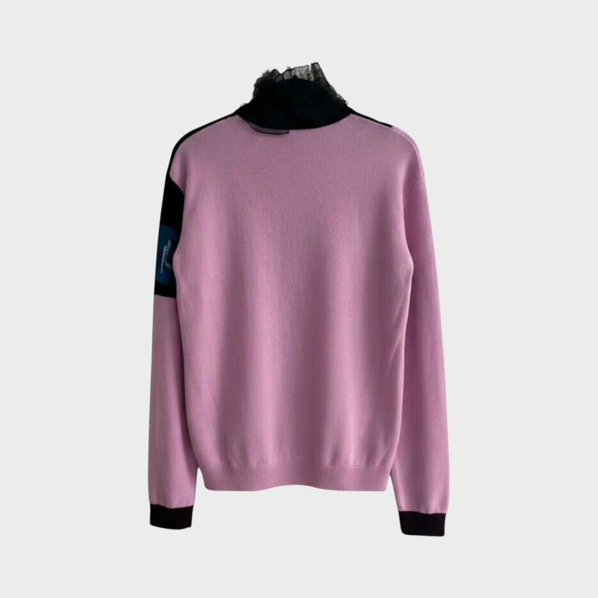 Tasoni Valentino pink wool jacquard sweater with a black lace turtleneck collar and black sleeve accents.