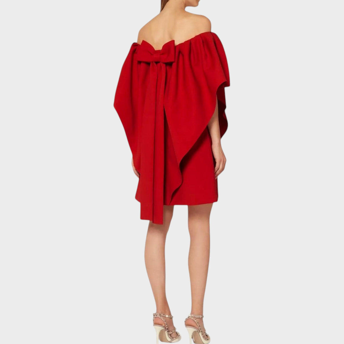 Tasoni Valentino red wool off-shoulder mini dress with a large back bow detail worn by a model