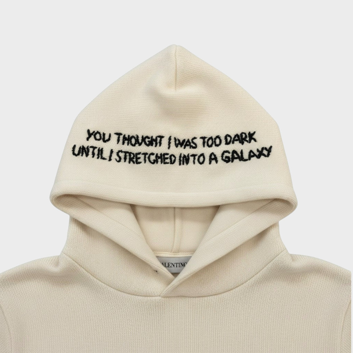 Tasoni Valentino x Undercover cream wool and cashmere hoodie featuring black embroidered text on the hood