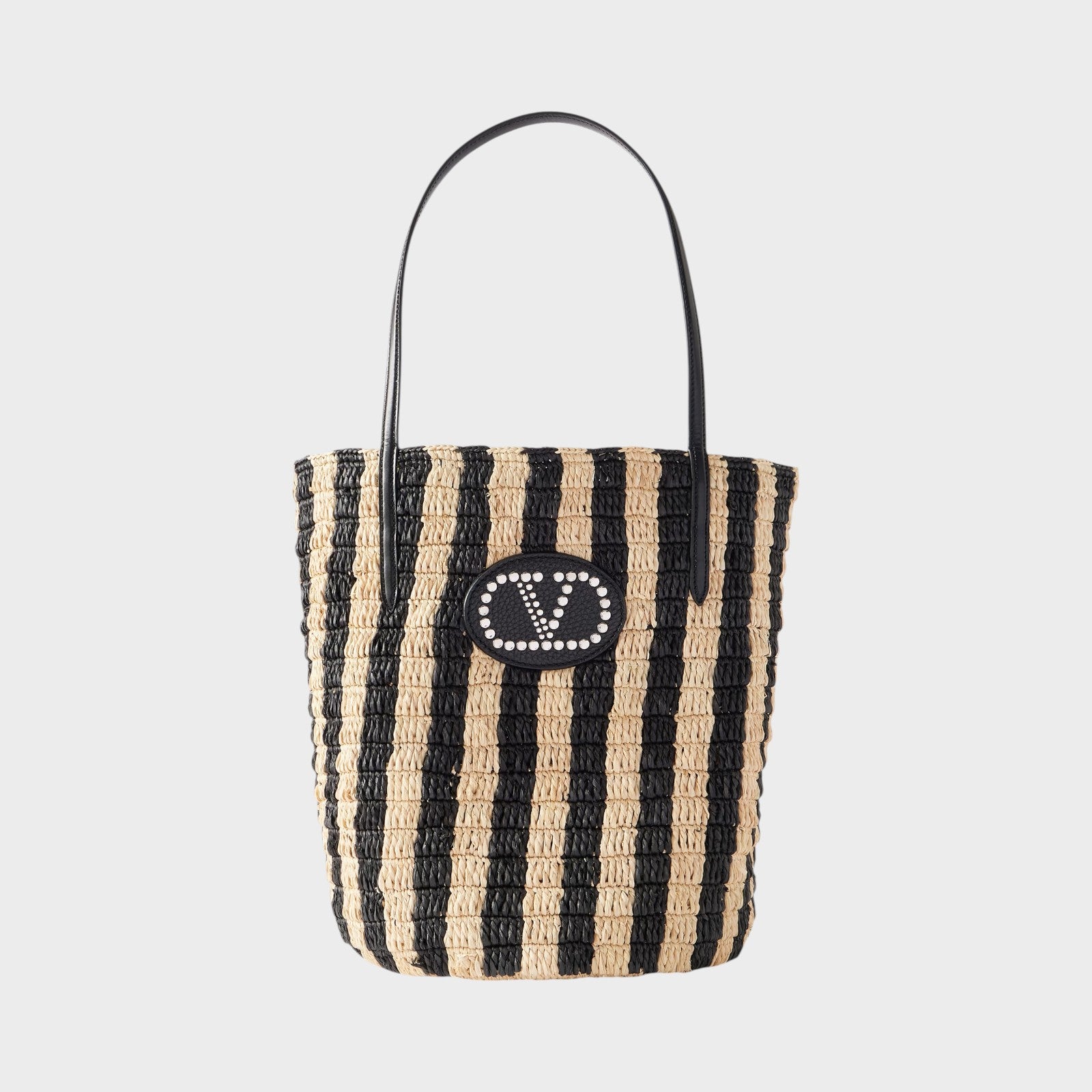 Tasoni Valentino V-Logo Crochet Raffia Bucket Bag with black and natural stripes and leather trim.