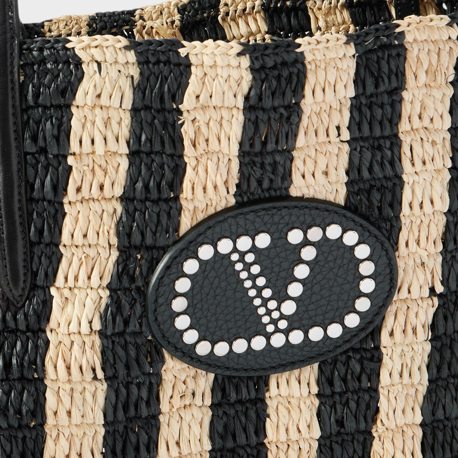 Tasoni Valentino V-Logo crochet raffia bucket bag with black and natural stripes and leather trim.