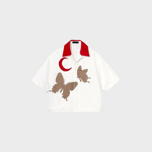 Tasoni white oversized short sleeve shirt with red collar, featuring brown butterfly and red crescent moon appliques.