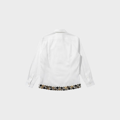Tasoni white cotton classic collar button-up shirt with a chest pocket and a decorative hem of silver and gold buttons.