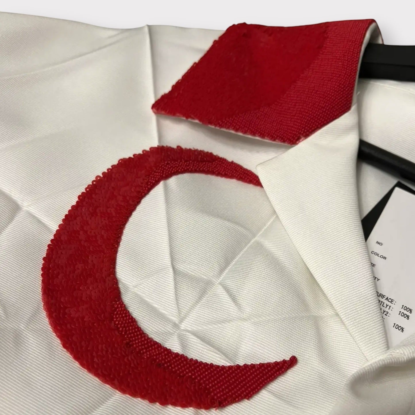 Tasoni white oversized shirt with a red sequined crescent moon and collar detail. Short sleeves.