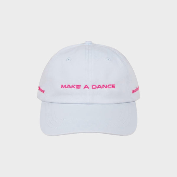 Tasoni x Alexandra Bachzetsis light blue baseball cap with pink embroidery 'MAKE A DANCE' and 'Weekend' text.