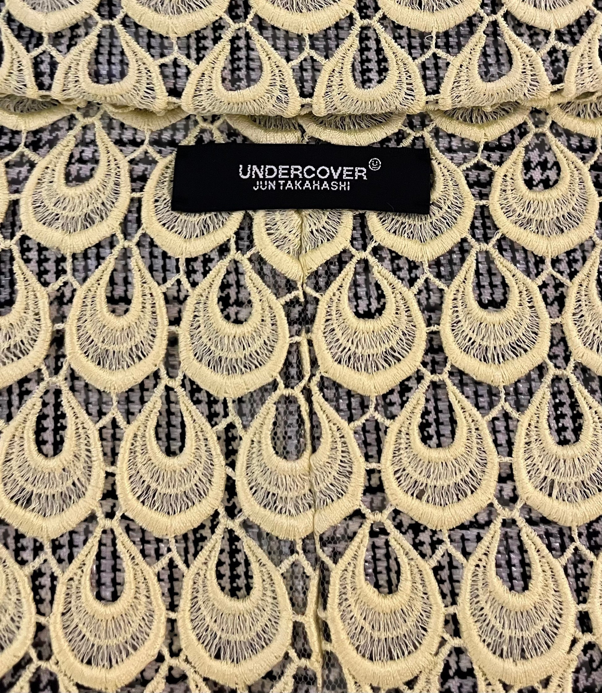 Tasoni Undercover yellow lace double-breasted blazer with a black and white houndstooth pattern.