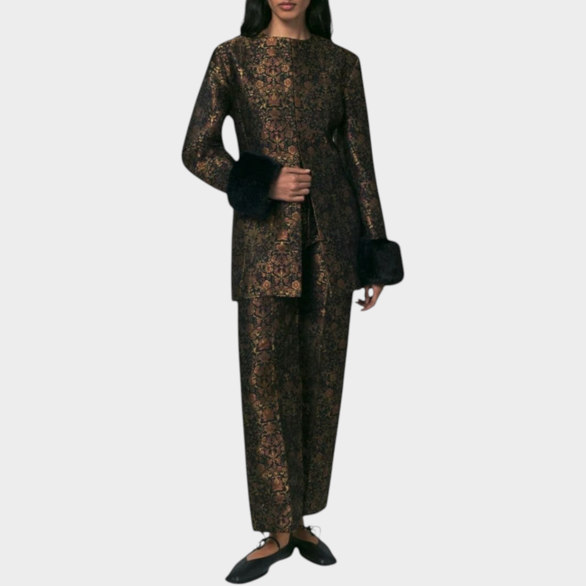 Model wearing Tasoni Destree Lea Garden structured jacket and matching trousers in black and rust floral brocade.